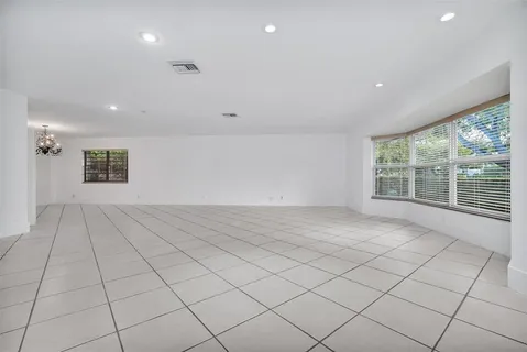 a view of an empty room and a window