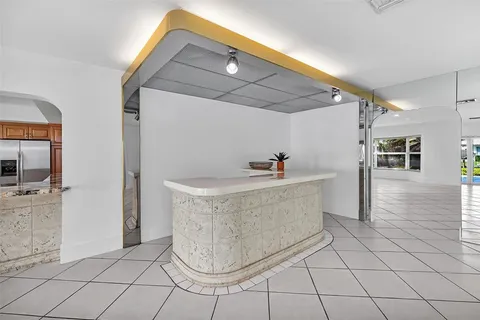 a view of entryway with kitchen