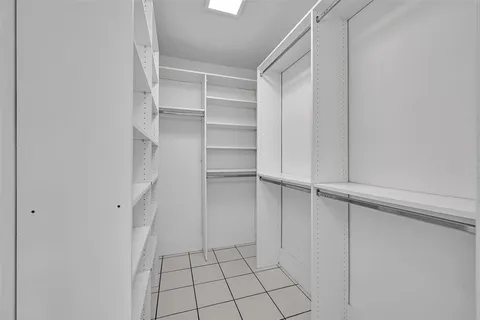 a view of an empty walk in closet
