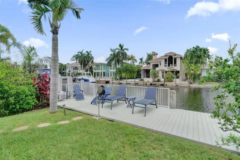 a view of a chair and table in the patio