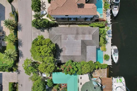 an aerial view of a house with a yard