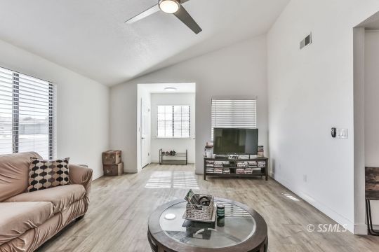 832 Walker Lane Ridgecrest, CA 93555 - Photo 4 of 23 a living room with furniture and a flat screen tv