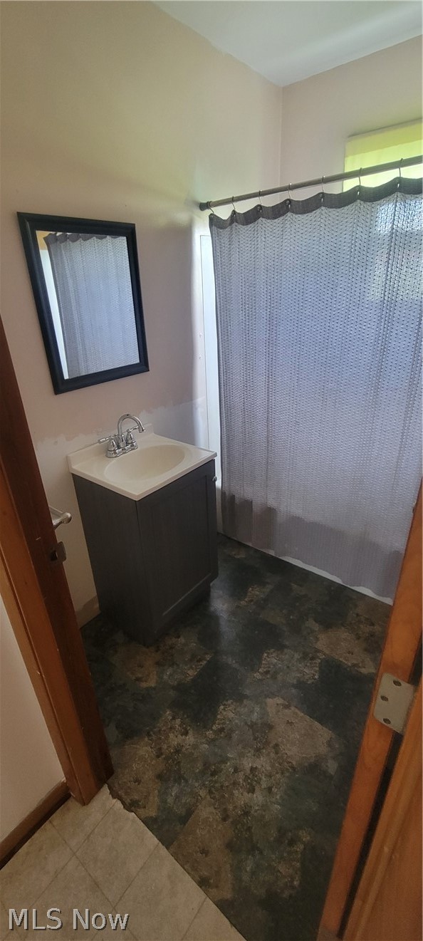 15560 Burton-Windsor Road Middlefield, OH 44062 - Photo 15 of 45 Bathroom featuring tile floors and vanity