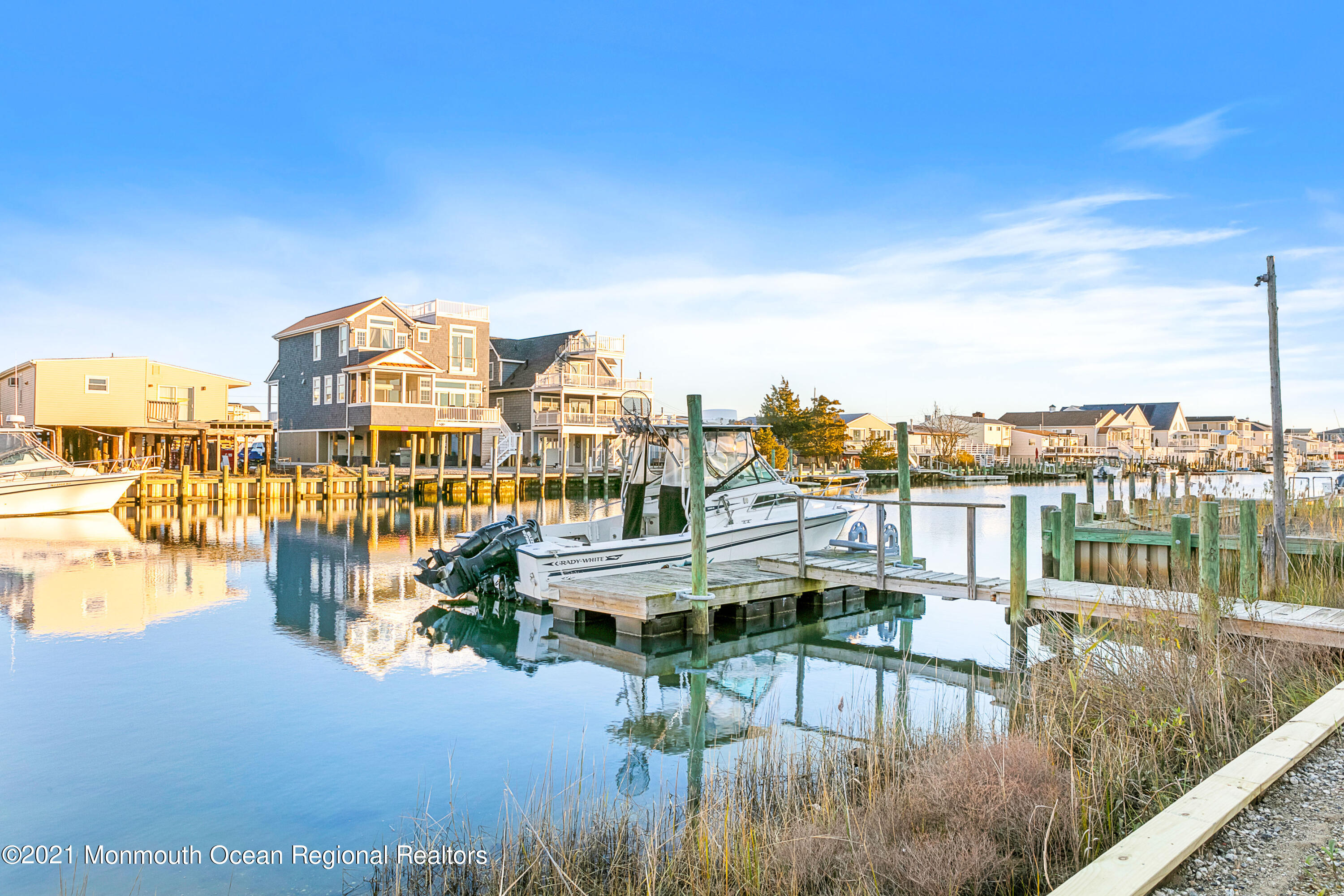 312 Heron Road Tuckerton, NJ 08087 - Photo 2 of 41 a view of a lake with building in front of it
