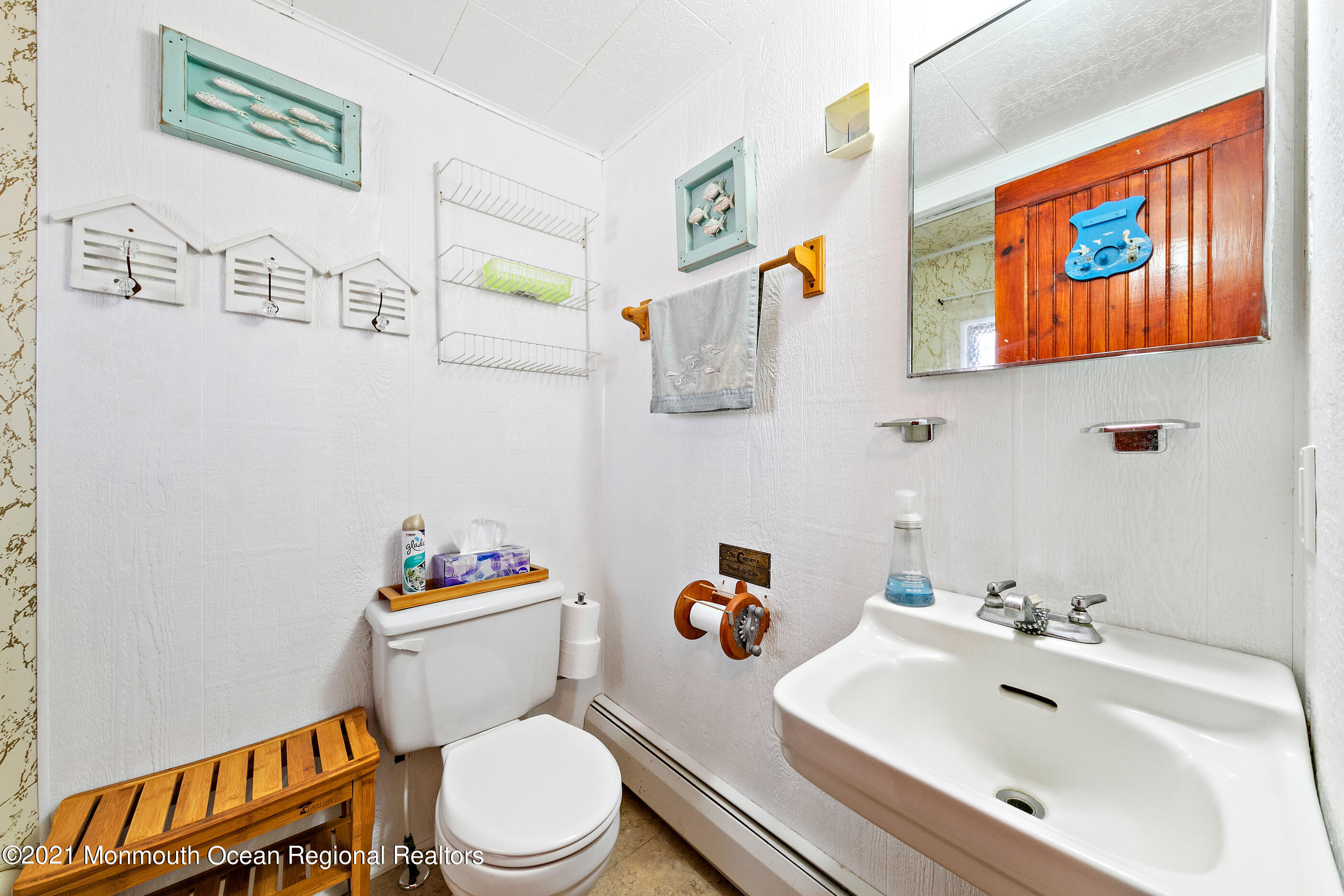 312 Heron Road Tuckerton, NJ 08087 - Photo 26 of 41 a white toilet sitting next to a bathroom sink
