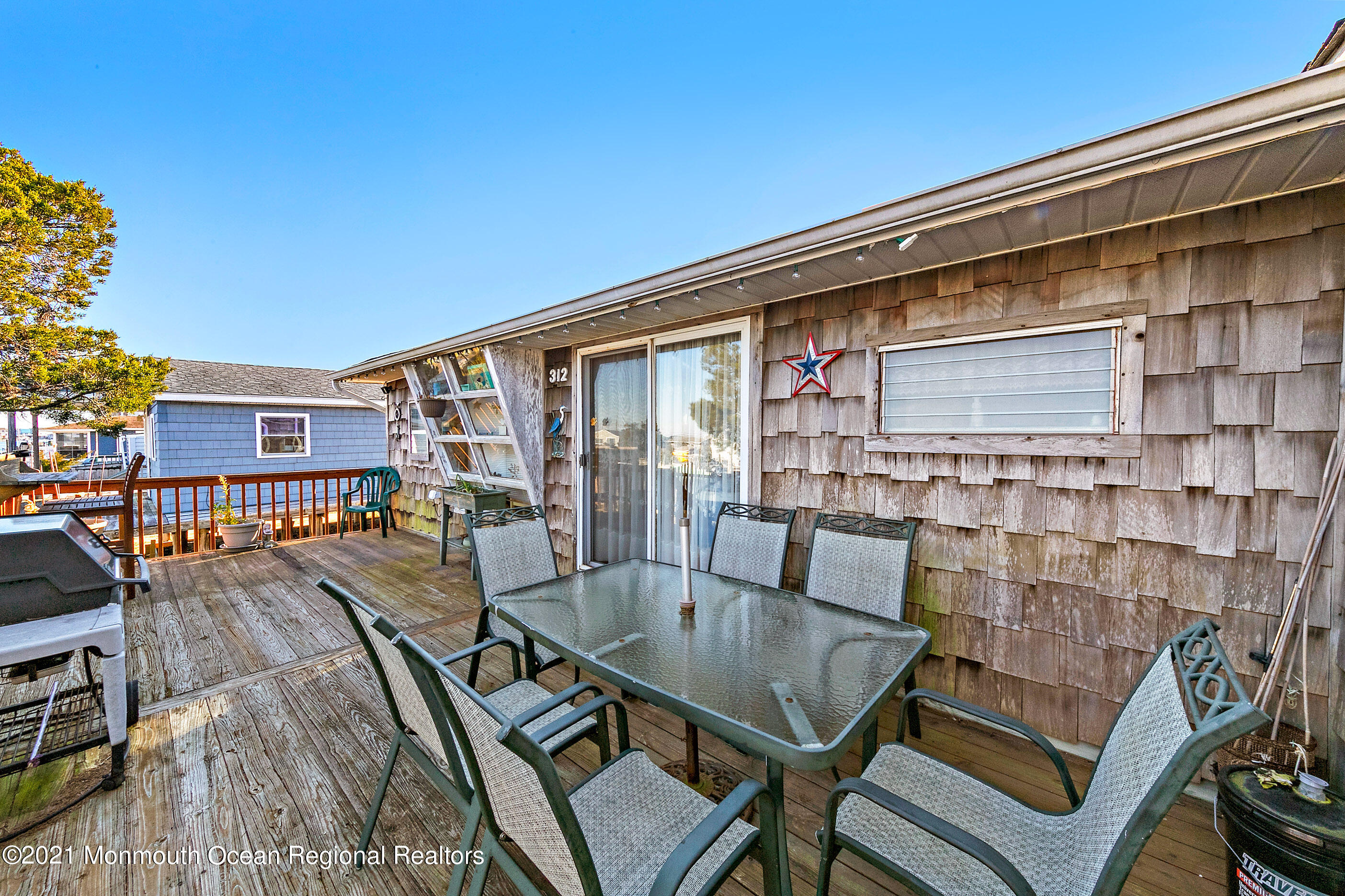 312 Heron Road Tuckerton, NJ 08087 - Photo 41 of 41 a balcony with table and chairs