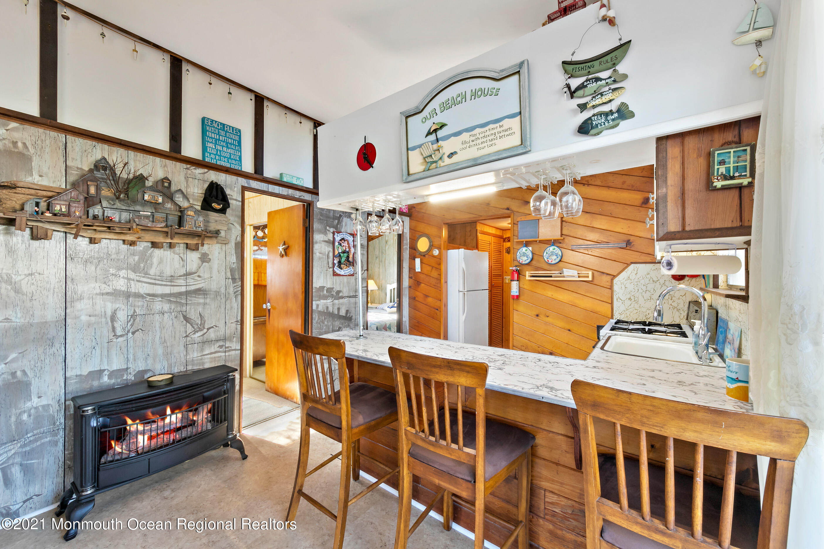 312 Heron Road Tuckerton, NJ 08087 - Photo 8 of 41 a dining room with furniture a flat screen tv and a couch