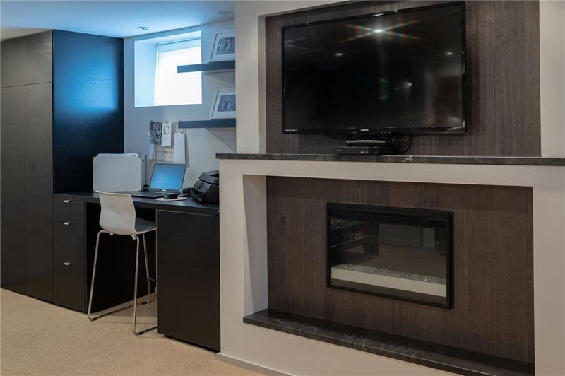 317 Pine Road Sewickley, PA 15143 - Photo 17 of 24 The finished basement has two desk areas and a gas fireplace