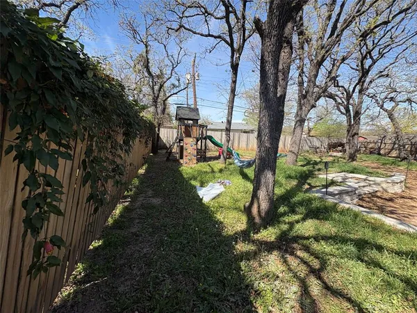 a view of swimming pool with a yard