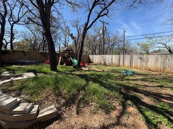 a view of a backyard with a fountain