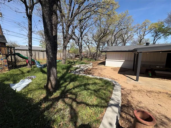 a view of a backyard of the house