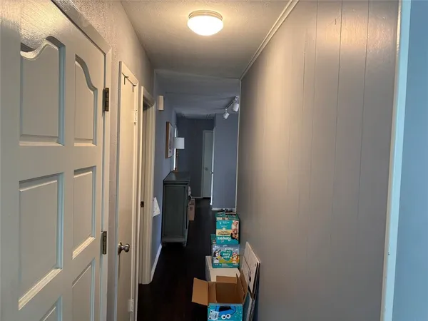 a very nice looking hallway with a chair