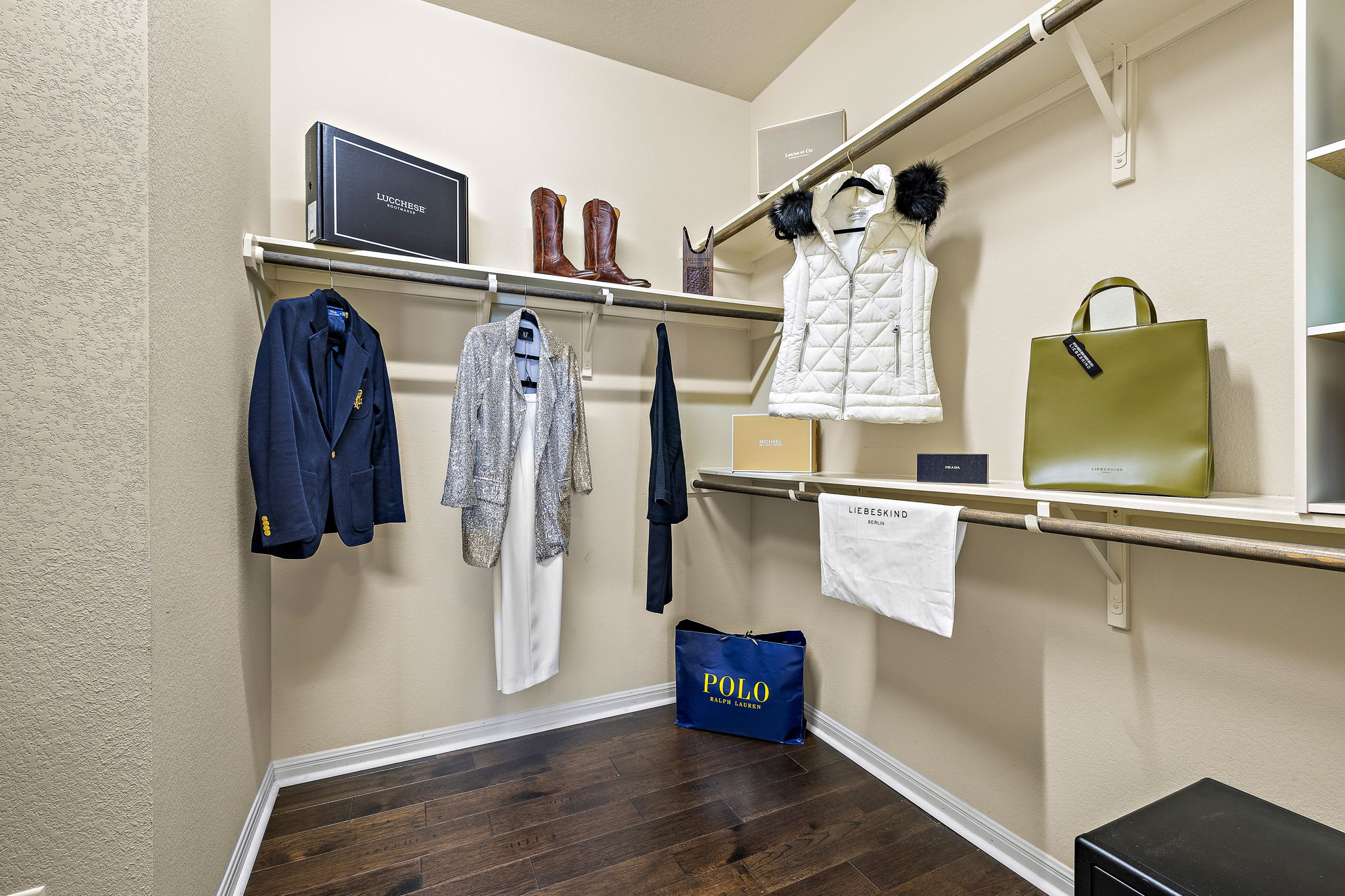 4413 Tambre Bend Austin, TX 78738 - Photo 16 of 30 a view of walk in closet with clothes and shoes