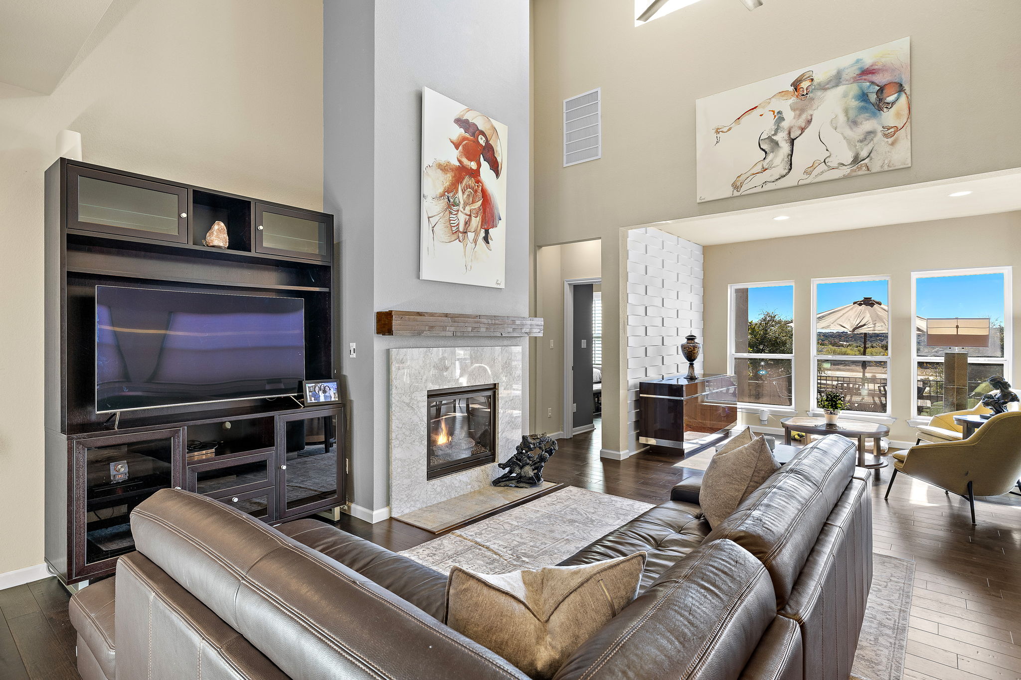 4413 Tambre Bend Austin, TX 78738 - Photo 2 of 30 a living room with furniture fireplace and flat screen tv