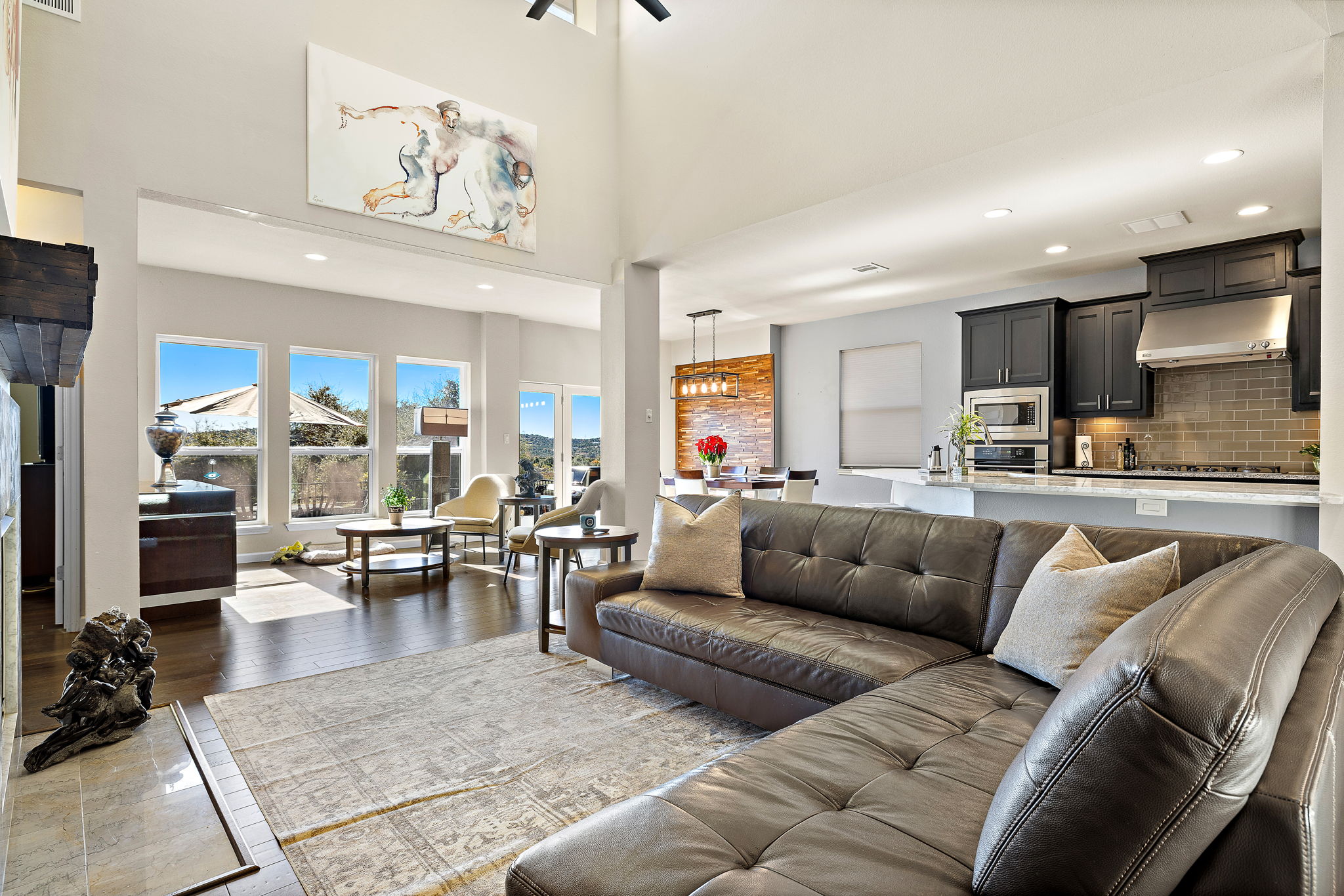 4413 Tambre Bend Austin, TX 78738 - Photo 4 of 30 a living room with furniture kitchen view and a large window