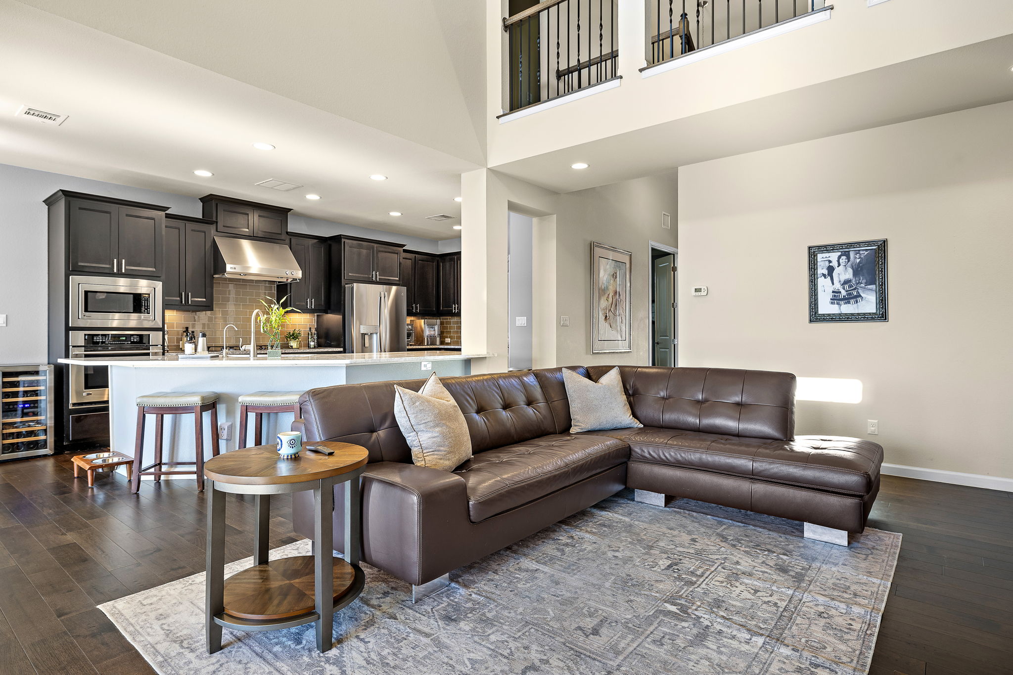 4413 Tambre Bend Austin, TX 78738 - Photo 5 of 30 a living room with furniture and a kitchen view