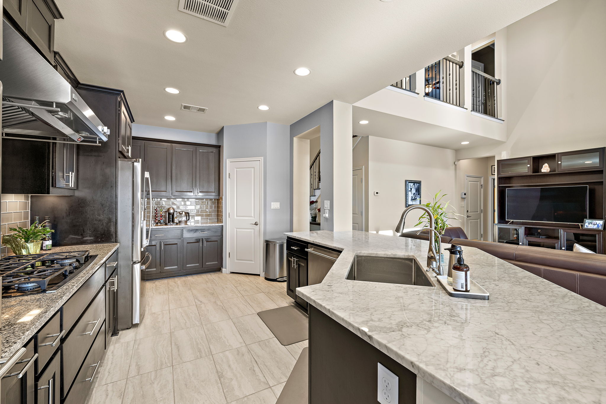 4413 Tambre Bend Austin, TX 78738 - Photo 30 of 30 a kitchen with sink stove and refrigerator
