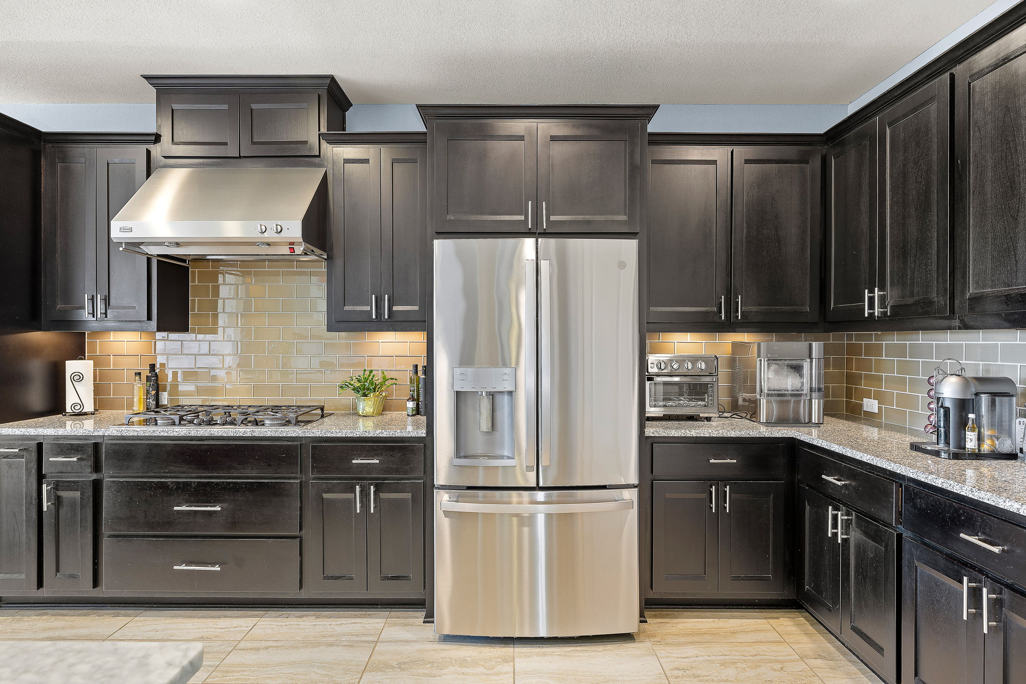 4413 Tambre Bend Austin, TX 78738 - Photo 8 of 30 a kitchen with a refrigerator and a sink