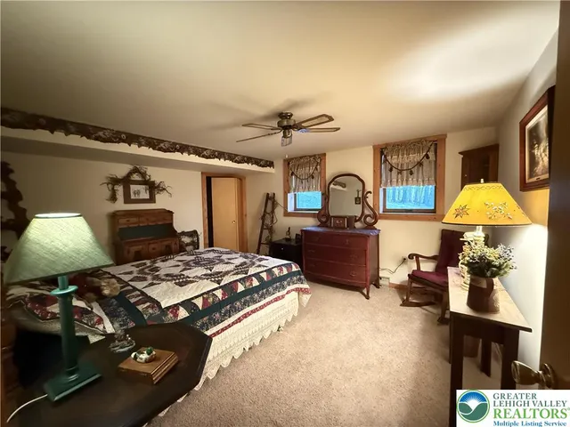 a bed room with furniture and a window