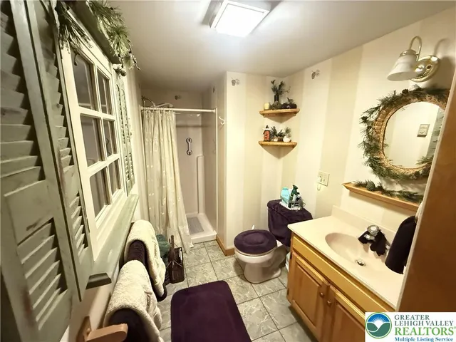 a living room with a couch and a chandelier