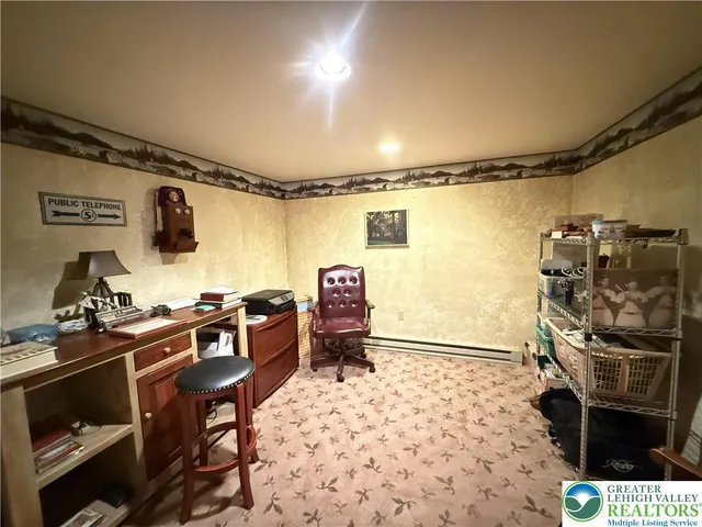 a bedroom with a bed and a television