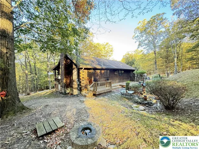 a view of a house with backyard porch and sitting area