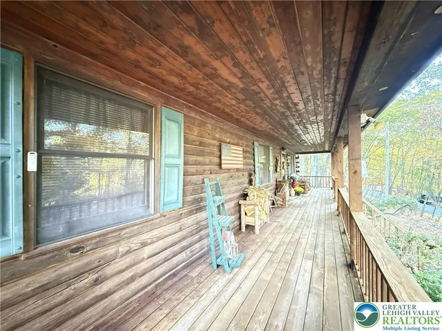 a view of swimming pool with outdoor seating