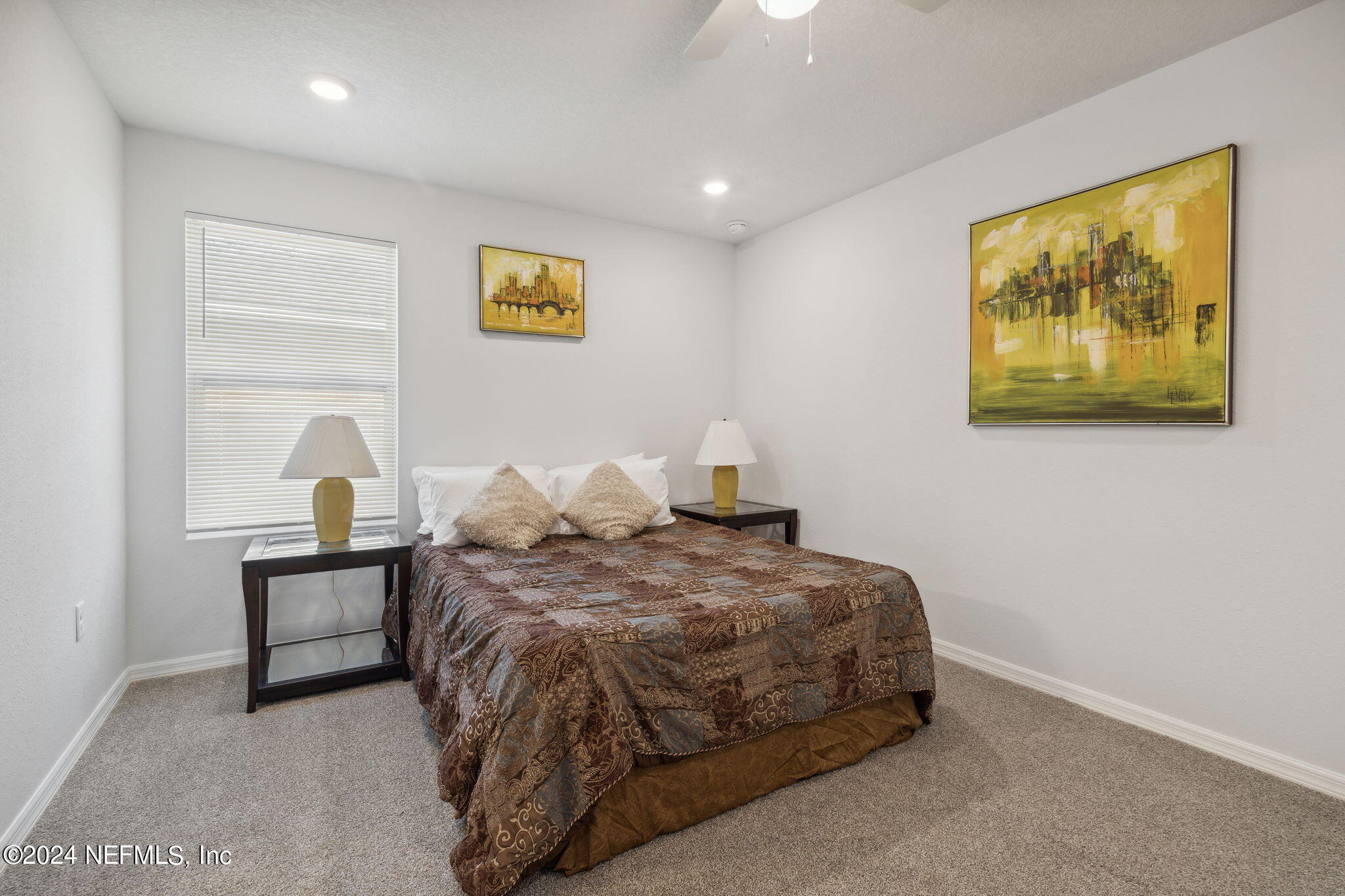 8320 Maple Street Jacksonville, FL 32244 - Photo 17 of 32 a bedroom with a bed and a painting on the wall