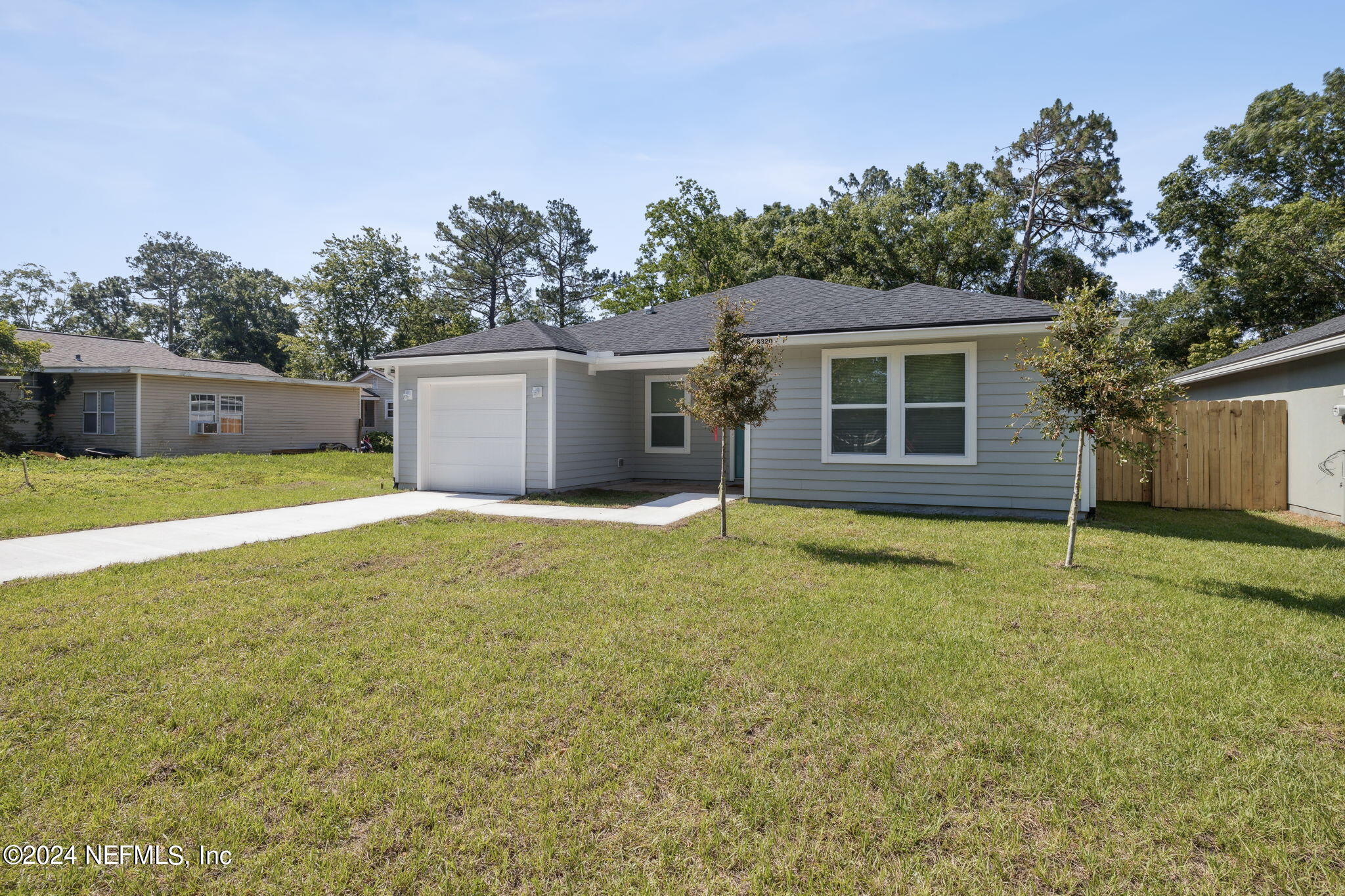 8320 Maple Street Jacksonville, FL 32244 - Photo 2 of 32 a view of a house with a yard