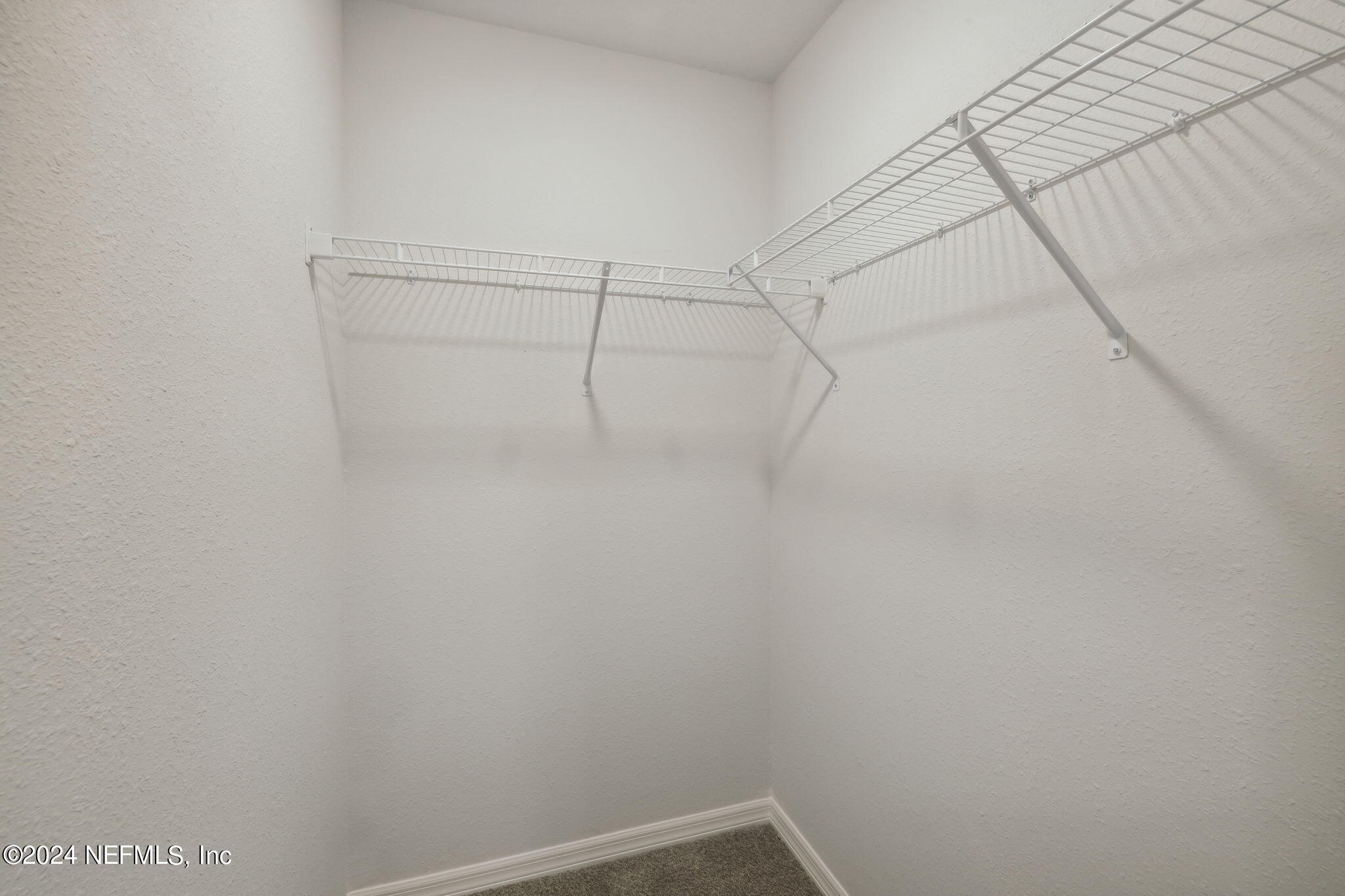 8320 Maple Street Jacksonville, FL 32244 - Photo 19 of 32 a view of a room with racks on the wall