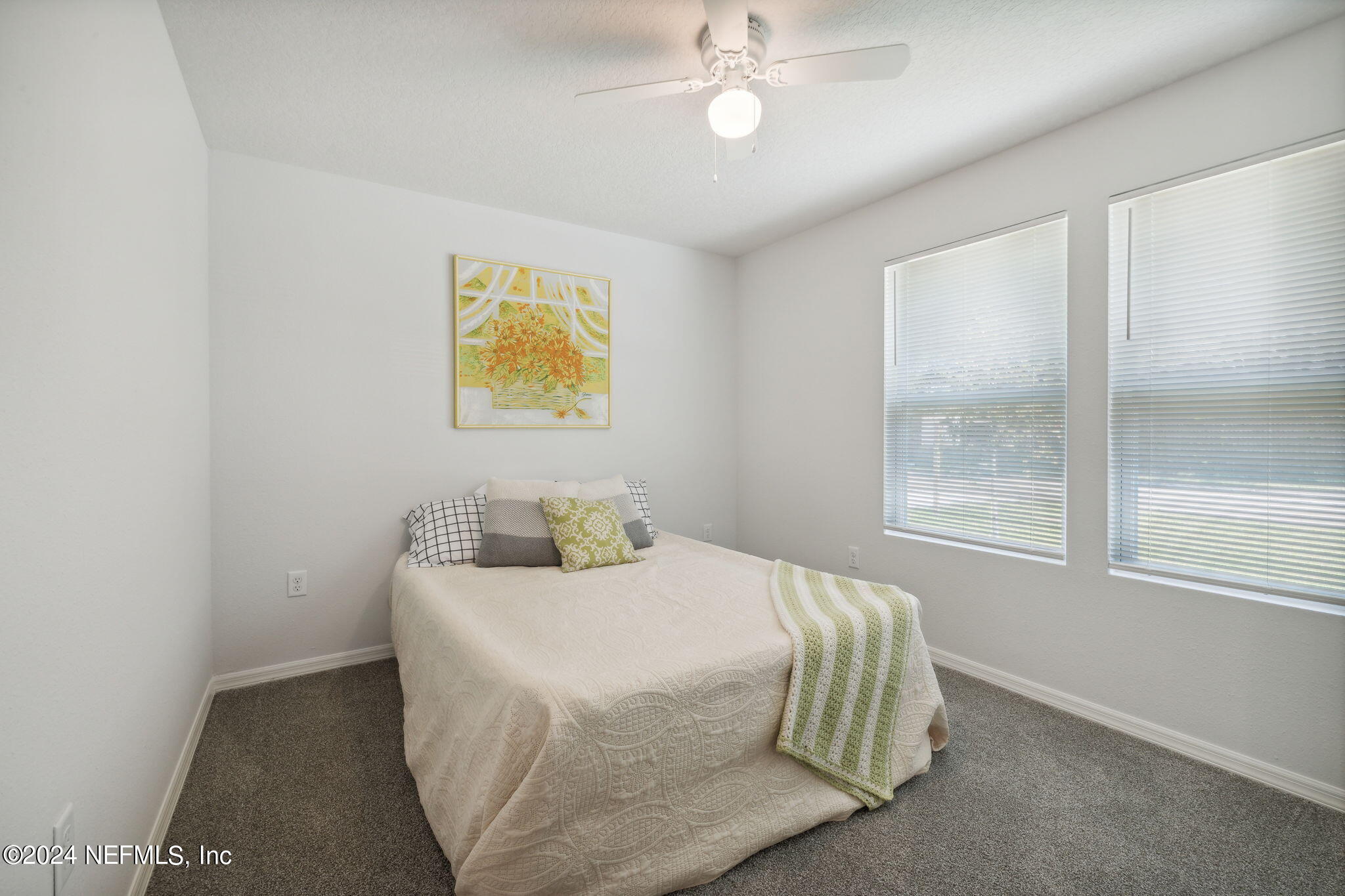 8320 Maple Street Jacksonville, FL 32244 - Photo 20 of 32 a bedroom with a bed and a window