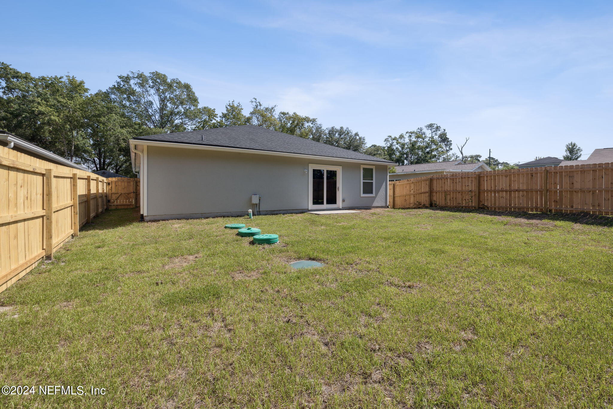 8320 Maple Street Jacksonville, FL 32244 - Photo 28 of 32 a view of a house with a yard and fence