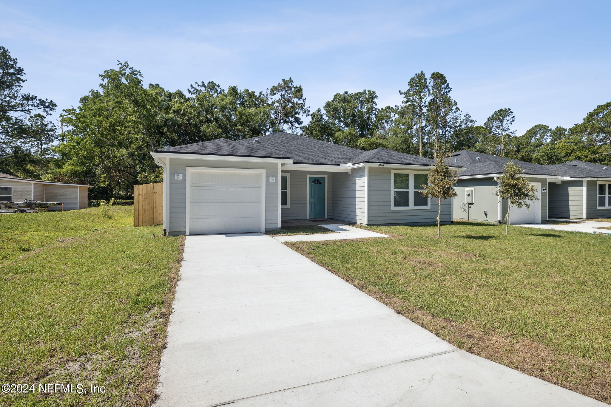 8320 Maple Street Jacksonville, FL 32244 - Photo 3 of 32 a front view of house with yard and trees in the background