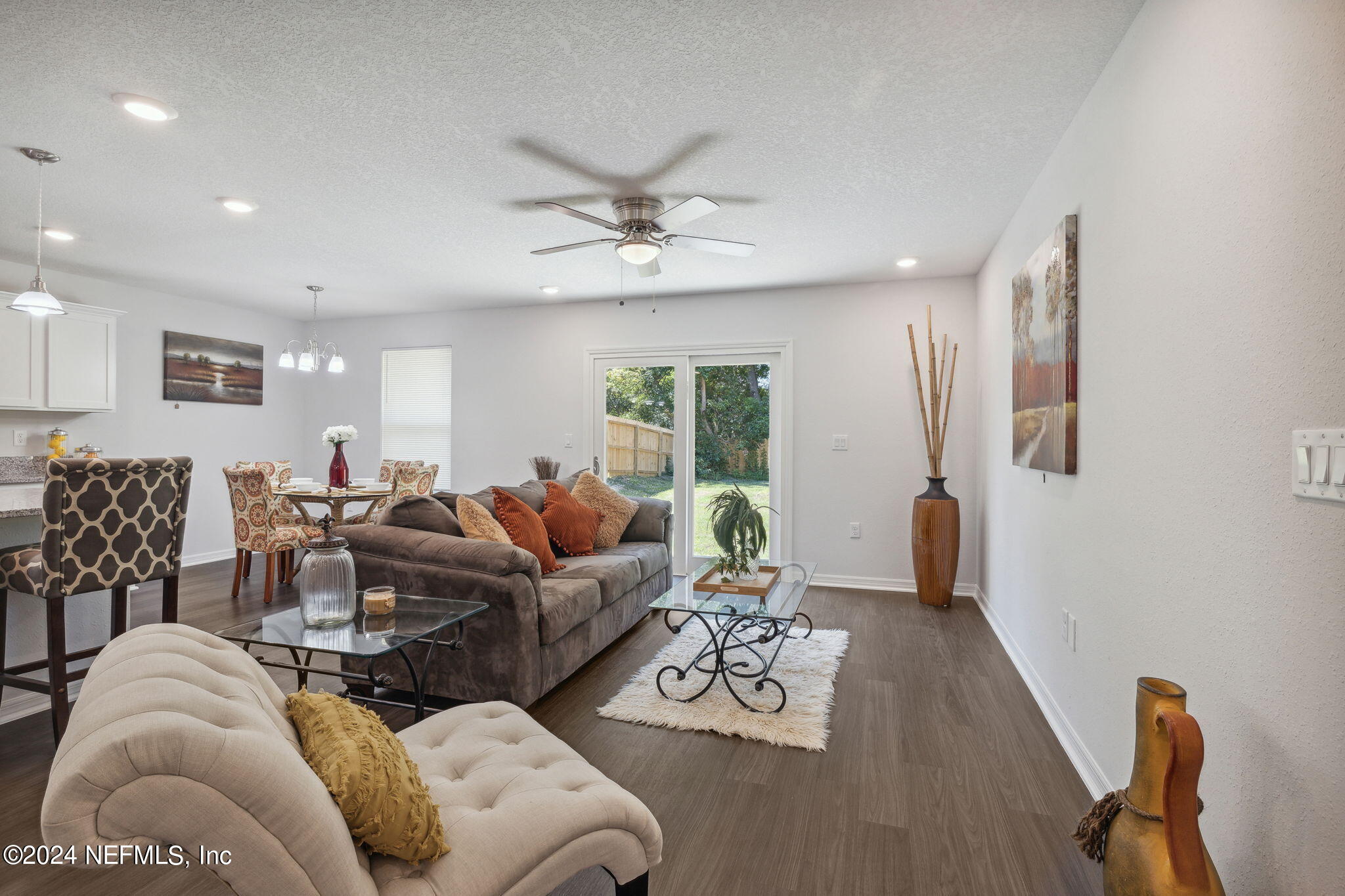 8320 Maple Street Jacksonville, FL 32244 - Photo 31 of 32 a living room with furniture and wooden floor