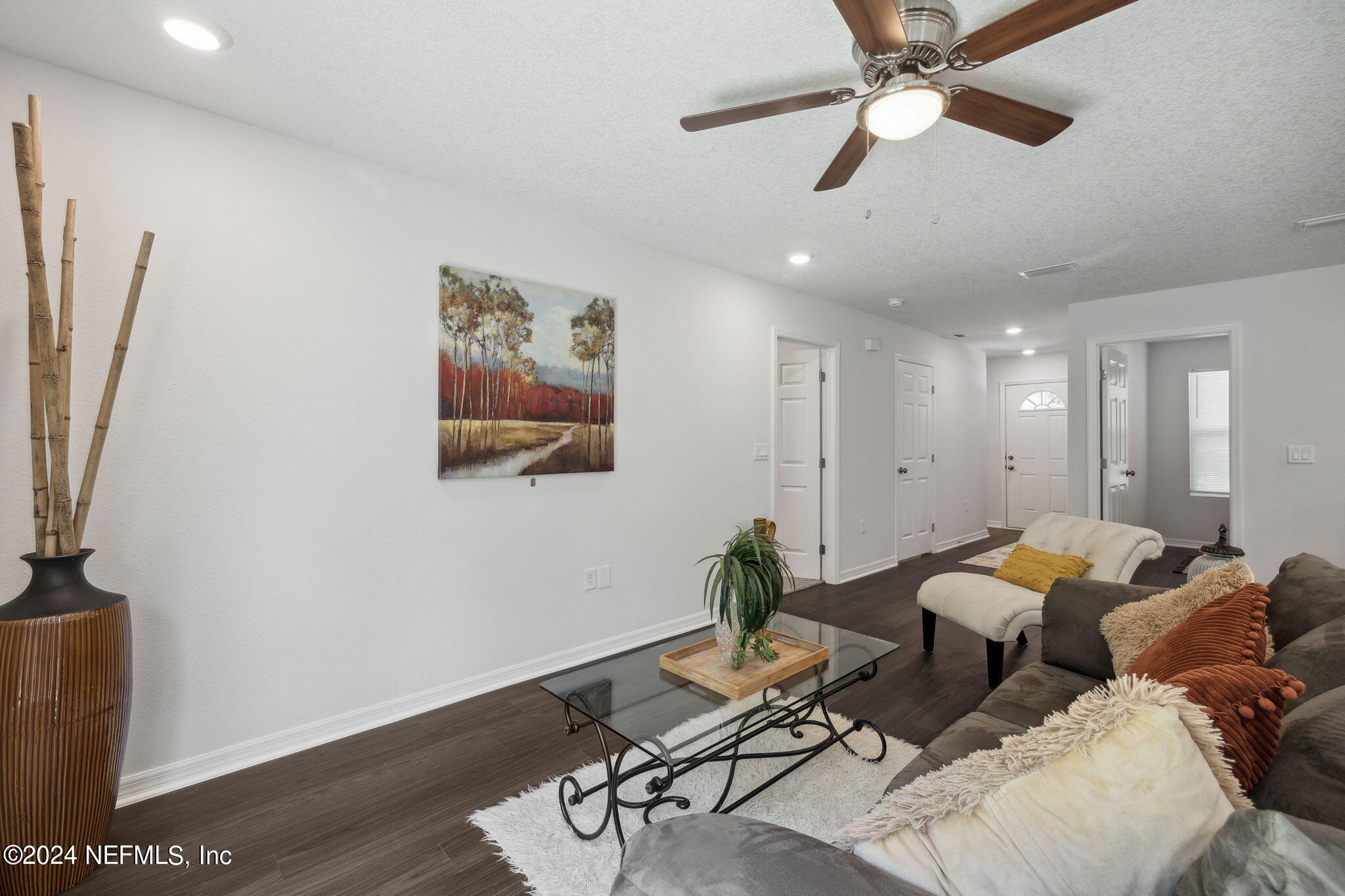 8320 Maple Street Jacksonville, FL 32244 - Photo 32 of 32 a living room with furniture and wooden floor