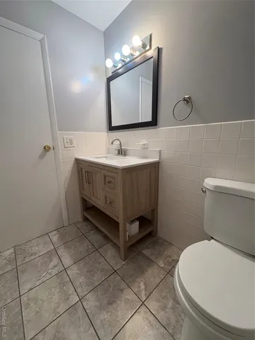 a kitchen with stainless steel appliances a refrigerator and a stove top oven