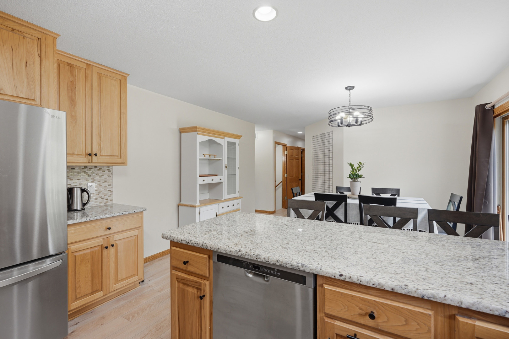 2237 Hickory Hills Road Muscatine, IA 52761 - Photo 10 of 53 a kitchen with appliances a sink and cabinets