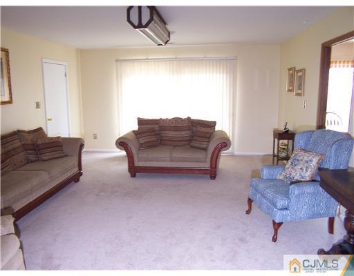 2 Crabtree Road Old Bridge, NJ 07747 - Photo 6 of 13 a living room with furniture and a couch