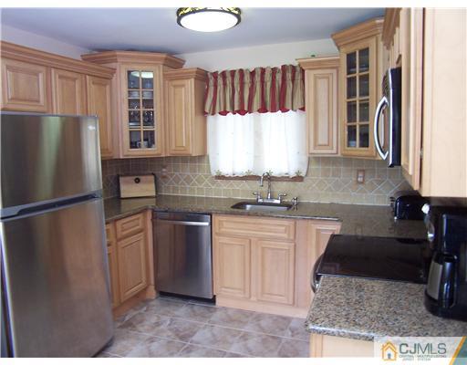 2 Crabtree Road Old Bridge, NJ 07747 - Photo 7 of 13 a kitchen with stainless steel appliances granite countertop a refrigerator sink and stove