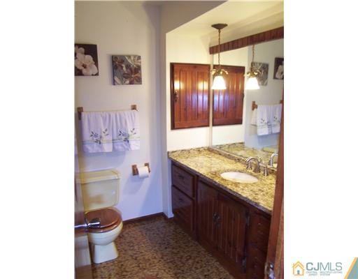 2 Crabtree Road Old Bridge, NJ 07747 - Photo 10 of 13 a bathroom with a granite countertop sink toilet and shower