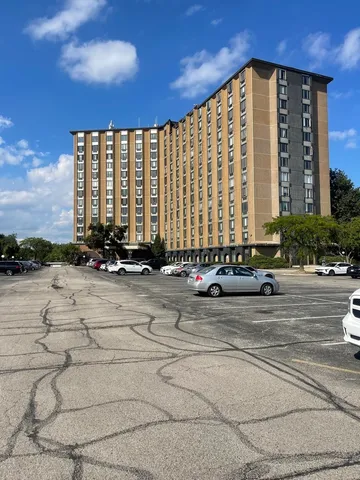 a view of a building with sitting area