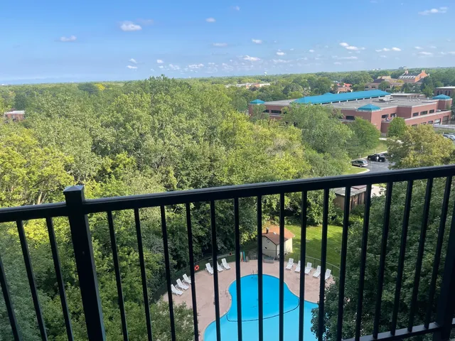a view of a green yard from a balcony