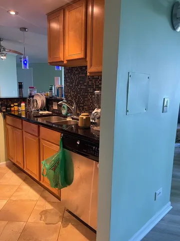 a kitchen with a sink and cabinets
