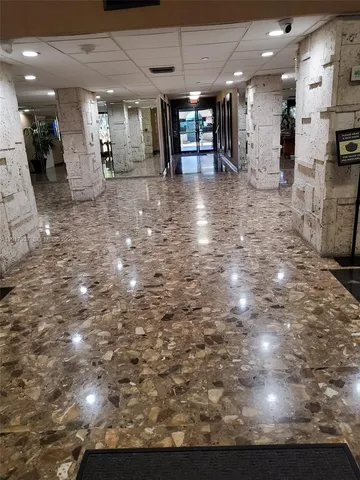 a view of a living room and kitchen