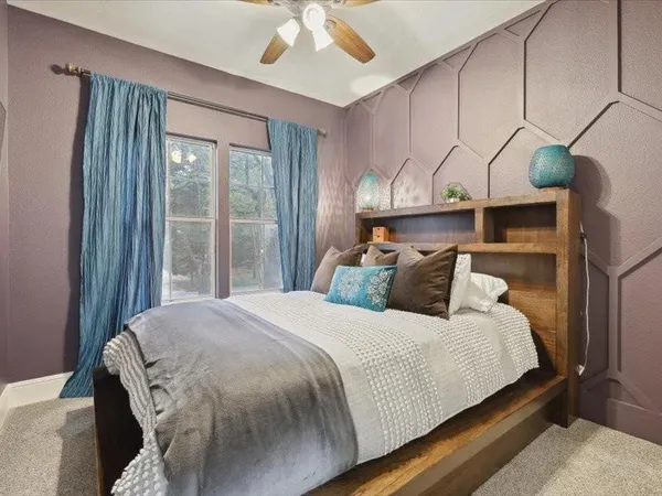 a bedroom with a bed and window