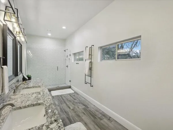 a wooden bench sitting in front of a building