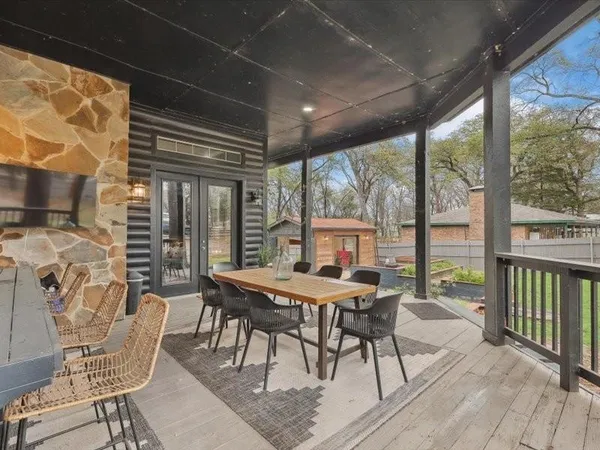 a view of a patio with a table chairs and a table