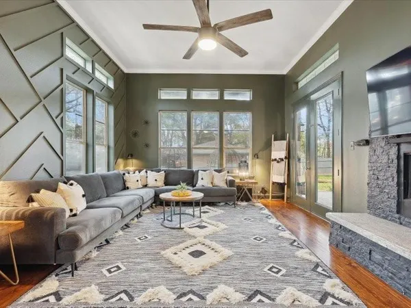 a living room with furniture and a large window