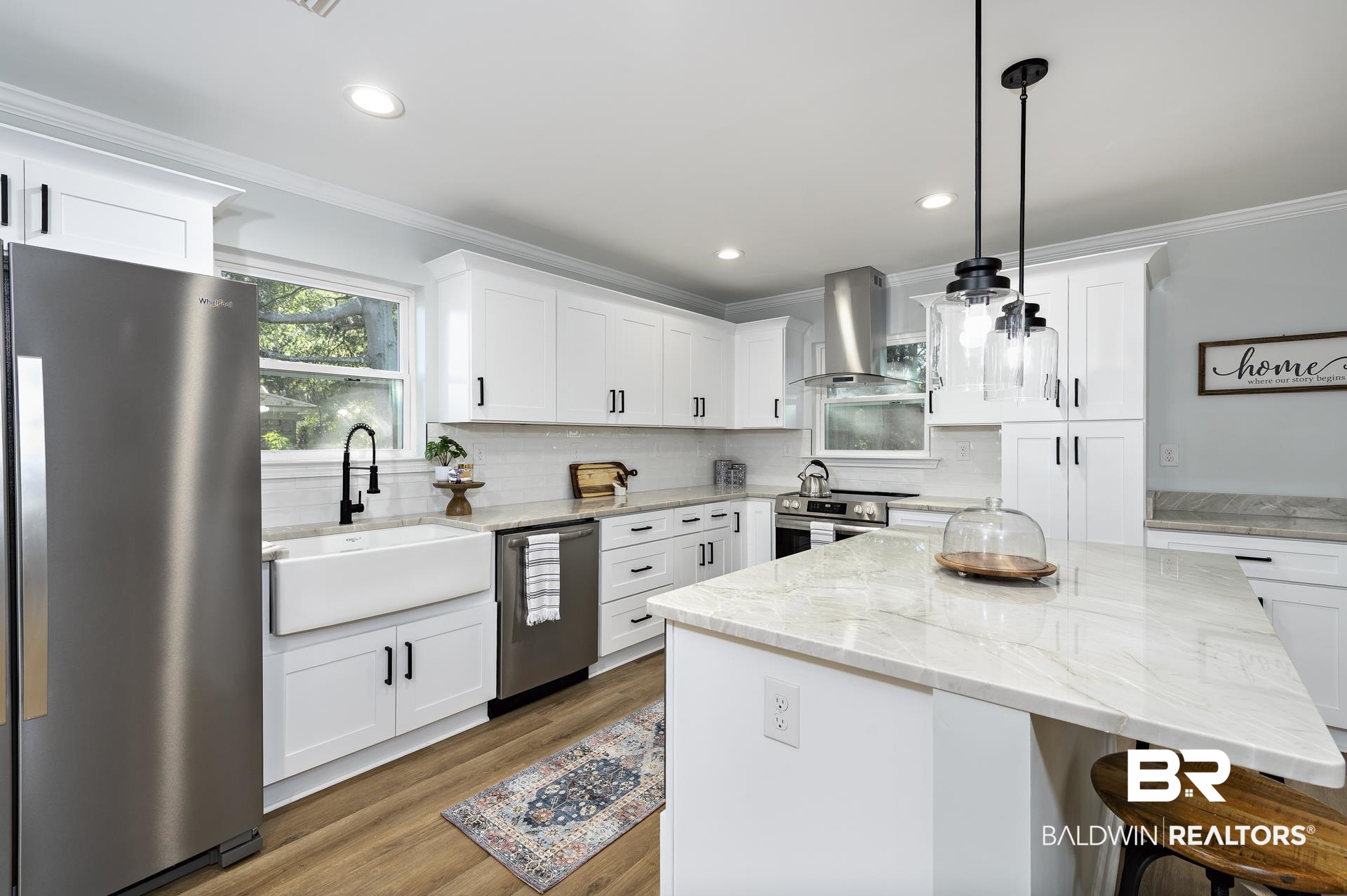 6001 Camp Halls Mill Road Mobile, AL 36619 - Photo 13 of 52 Kitchen featuring stainless steel appliances, light stone countertops, backsplash, crown molding, and island range hood