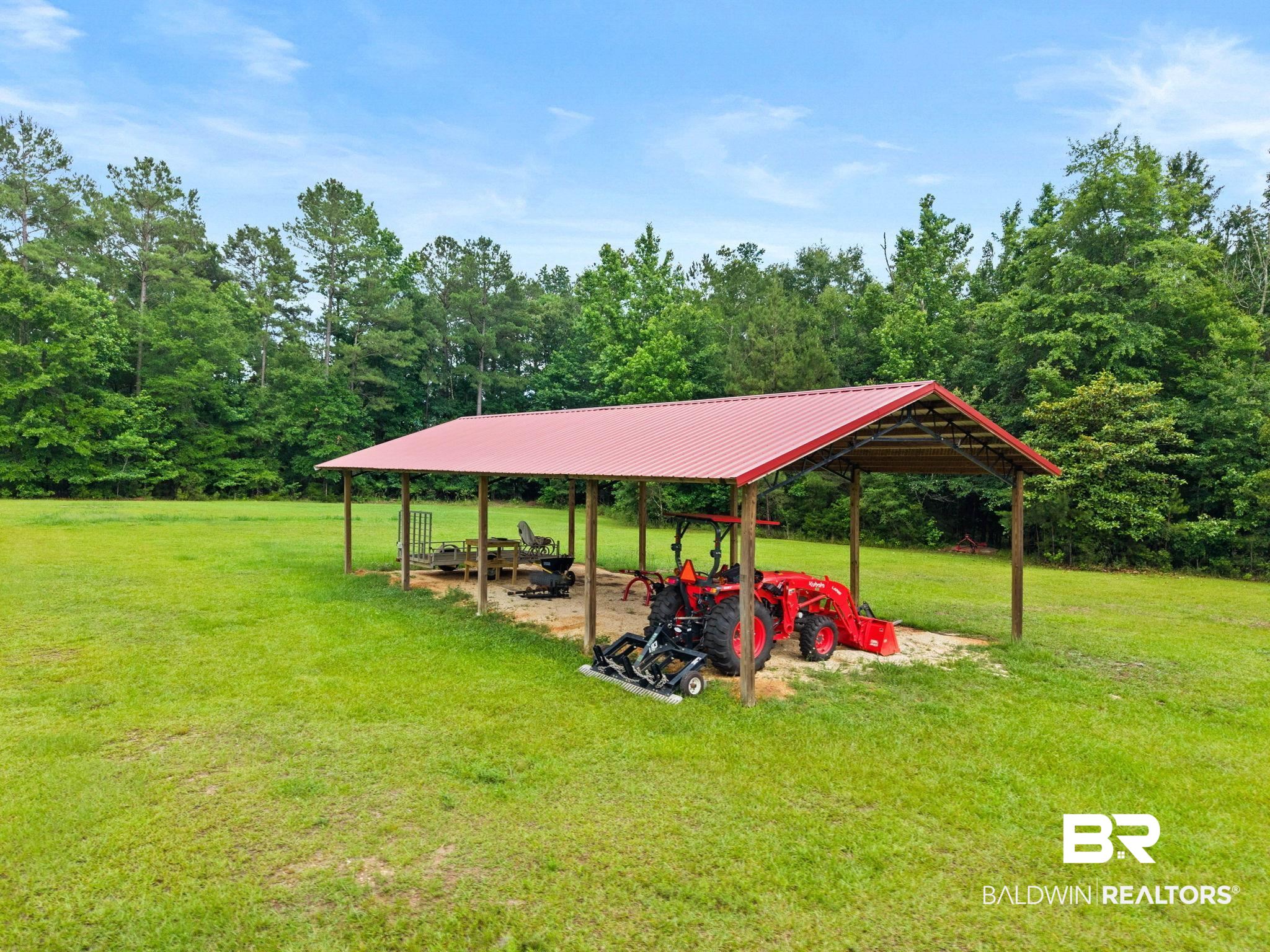 2029 George Lee Road Repton, AL 36475 - Photo 57 of 58 Open-air shed with a red metal roof and wooden post construction